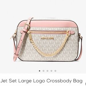 Michael Kors crossbody bag. The color is white with light pink
